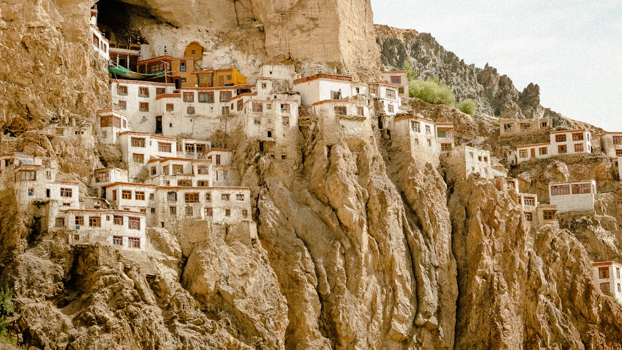 A monastery built into a steep mountain cliff in Ladakh