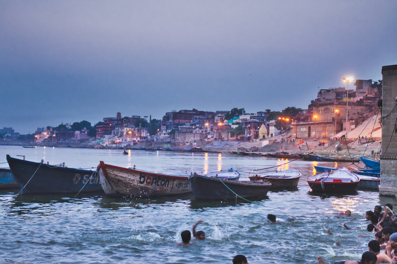 Wooden boats moored along the river steps at Varanasi, India